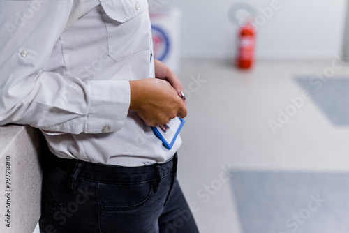 Security guard standing at entrance hallway