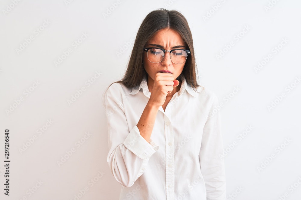 Young beautiful businesswoman wearing glasses standing over isolated white background feeling unwell and coughing as symptom for cold or bronchitis. Healthcare concept.