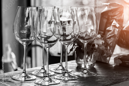 Black and white glasses for alcohol and wine are on the bar in a restaurant or cafe before dinner, a romantic date on the weekend.