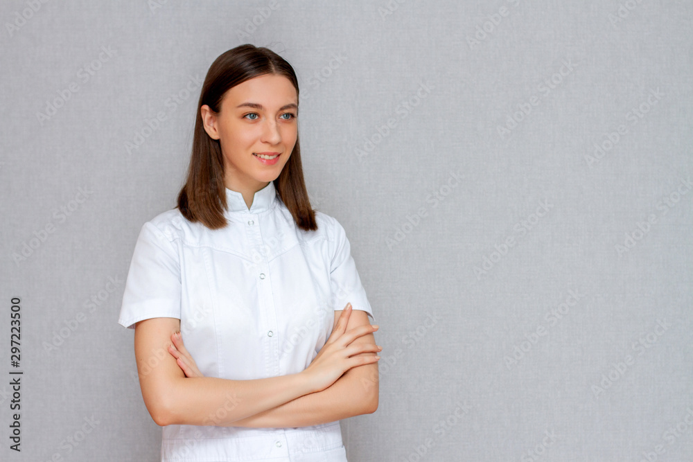 female doctor in white coat studio portrait