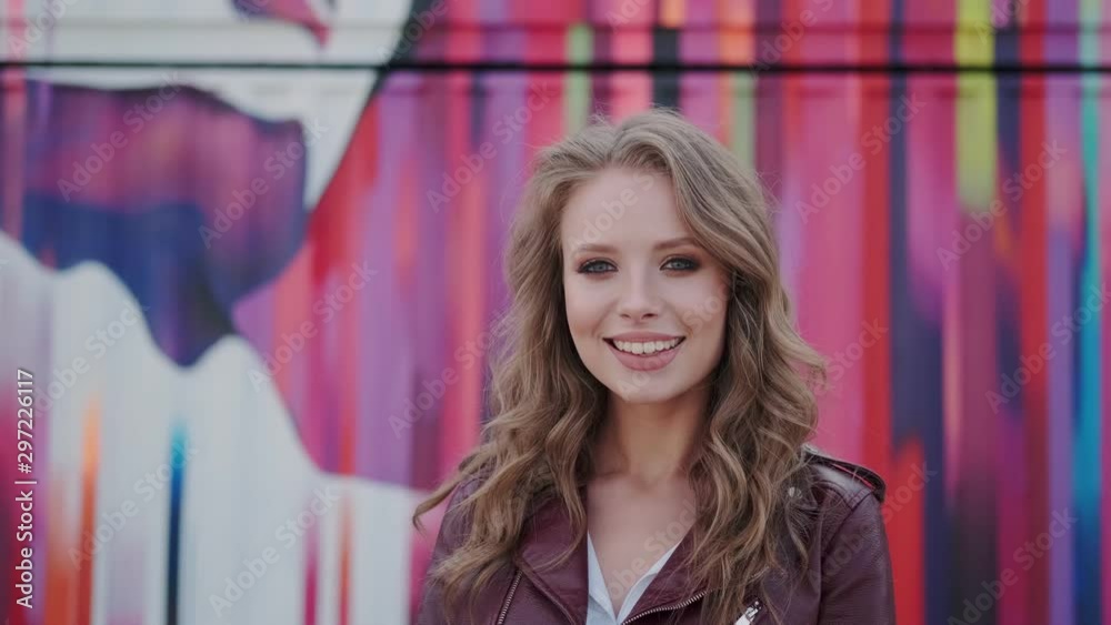 Portrait of a cute girl with a charming prepossessing smile. young woman looking at camera and smiling. Portrait of a cute girl with a charming prepossessing smile. young woman looking at camera and smiling.