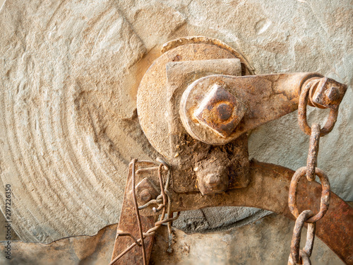 Antique stone grinding wheel and axle.