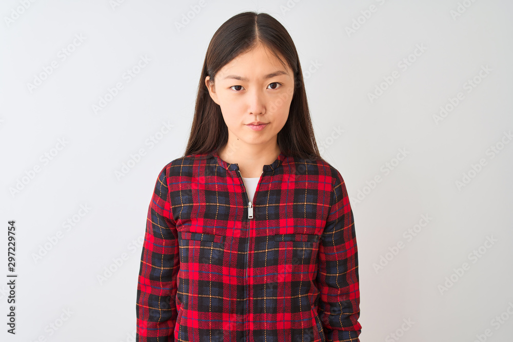 Young chinese woman wearing casual jacket standing over isolated white background skeptic and nervous, frowning upset because of problem. Negative person. Young chinese woman wearing casual jacket standing over isolated white background skeptic and nervous, frowning upset because of problem. Negative person.