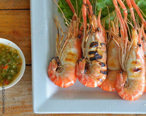 Grilled shirmp asian style food on wooden background. photo