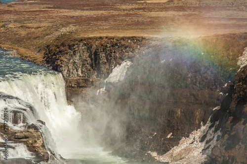 A rainbow over the three-step staircase of the Gullfoss waterfall on Hvita river in southern Iceland