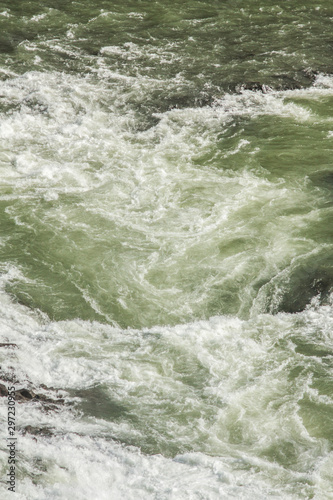 A three-step staircase of the Gullfoss waterfall on Hvita river, as pictured in detail (water plunging into the canyon, mossy cliffs, thick spray, panorama of the rapids)