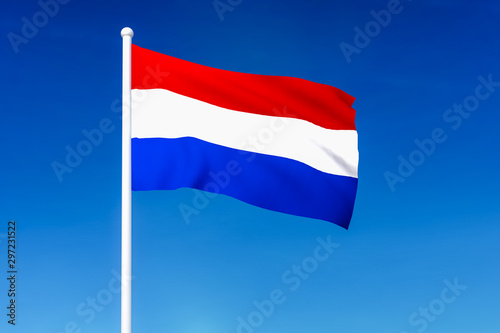Waving flag of Netherlands on the blue sky background Free Download Waving flag of Netherlands on the blue sky background - GFXLoad