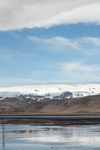 An outwash plain Mýrdalssandur in Iceland built by jokulhaups of the Mýrdalsjökull glacier which jokulhaups were caused by volcanic activity and eruptions of Katla that sits underneath its ice sheet photo