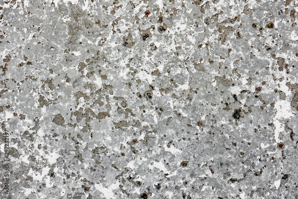 Texture of a concrete wall with cracks and scratches which can be used as a background Texture of a concrete wall with cracks and scratches which can be used as a background