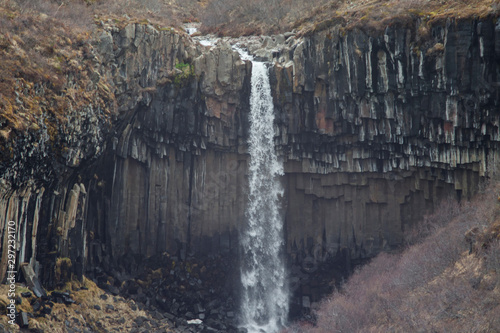 Basalt rock formations and lava columns of Svartifoss waterfall in Skaftafell, Vatnajökull National Park, in Iceland