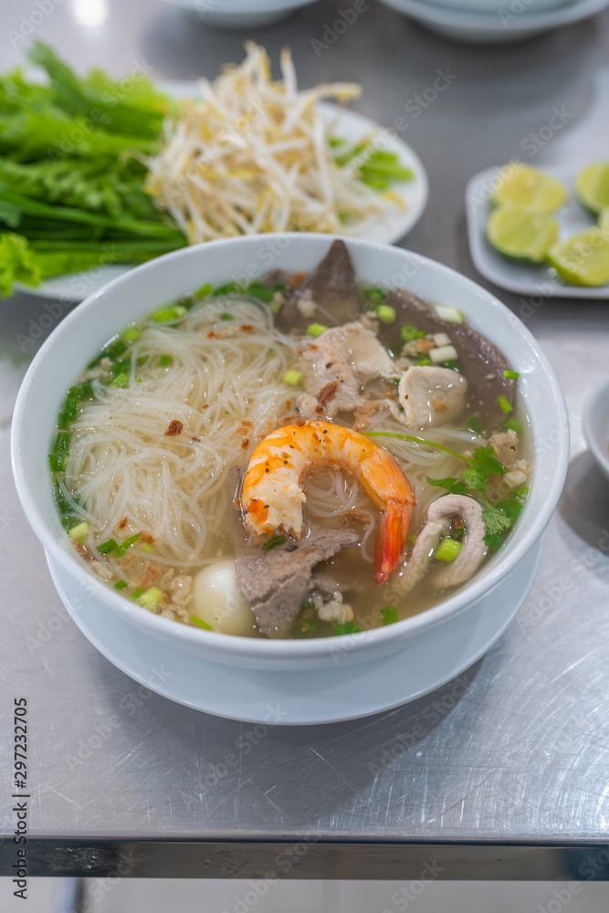 Vertical photo of Vietnamese popular rice noodle soup- Hu Tiu