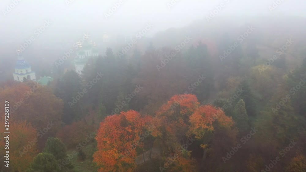 4k Foggy autumn park with churches. Aerial drone shot 4k Foggy autumn park with churches. Aerial drone shot