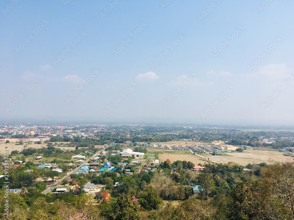 Landscape view point of low mountain, see small house village and blue sky