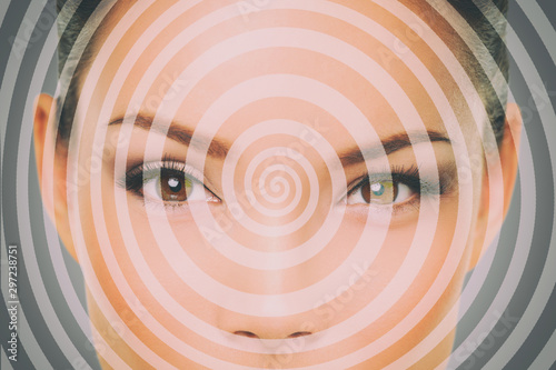 Hypnosis hypnotize spiral over woman face for mind control. photo