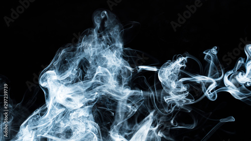 Photo of a wisp of smoke on a dark background photo