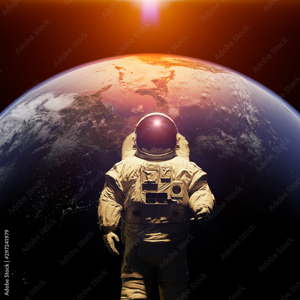 standing astronaut in front of planet Earth