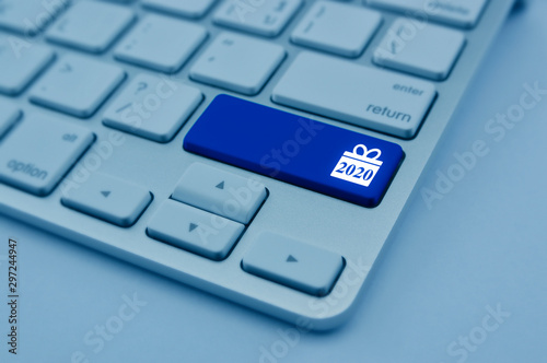 Gift box happy new year 2020 flat icon on modern computer keyboard button, blue tone, Business shop online concept