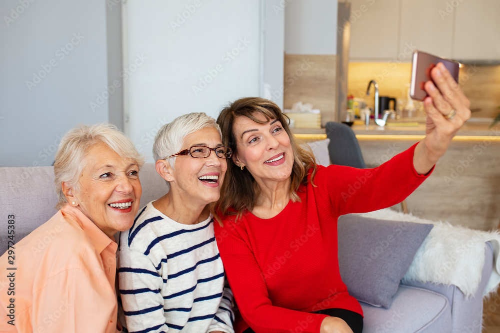 Beautiful Senior Women Having Fun Taking Selfies At Home Senior Friends Using A Phone Senior