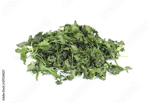 Heap of dried parsley on white background