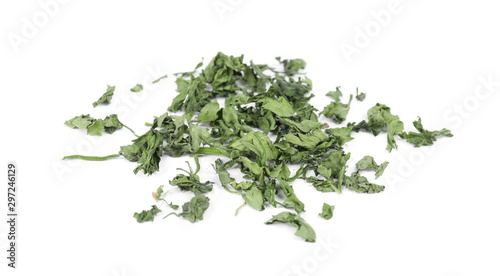 Scattered aromatic dried parsley on white background