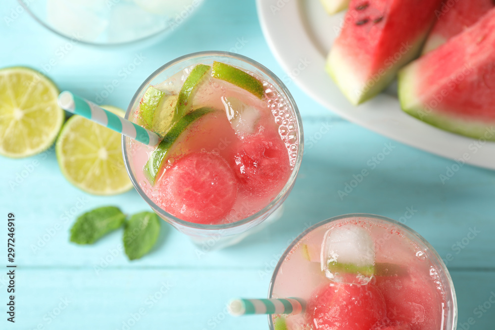 Delicious refreshing watermelon drink on blue wooden table, top view Delicious refreshing watermelon drink on blue wooden table, top view