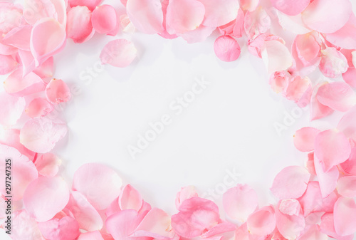 Fototapeta Naklejka Na Ścianę i Meble -  Top view of pink rose petals on white background.Valentine's day concept.