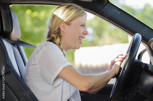 annoyed female driver inside a car © auremar