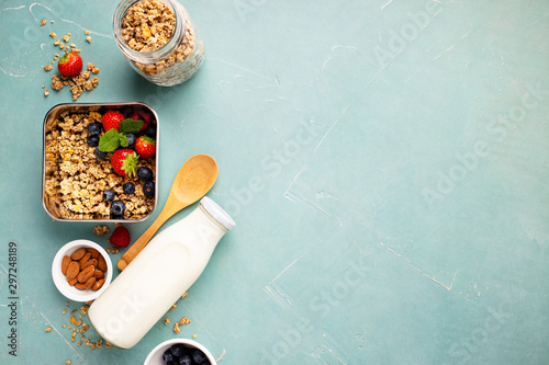 Fotografie Metal container with ingredients for healthy breakfast