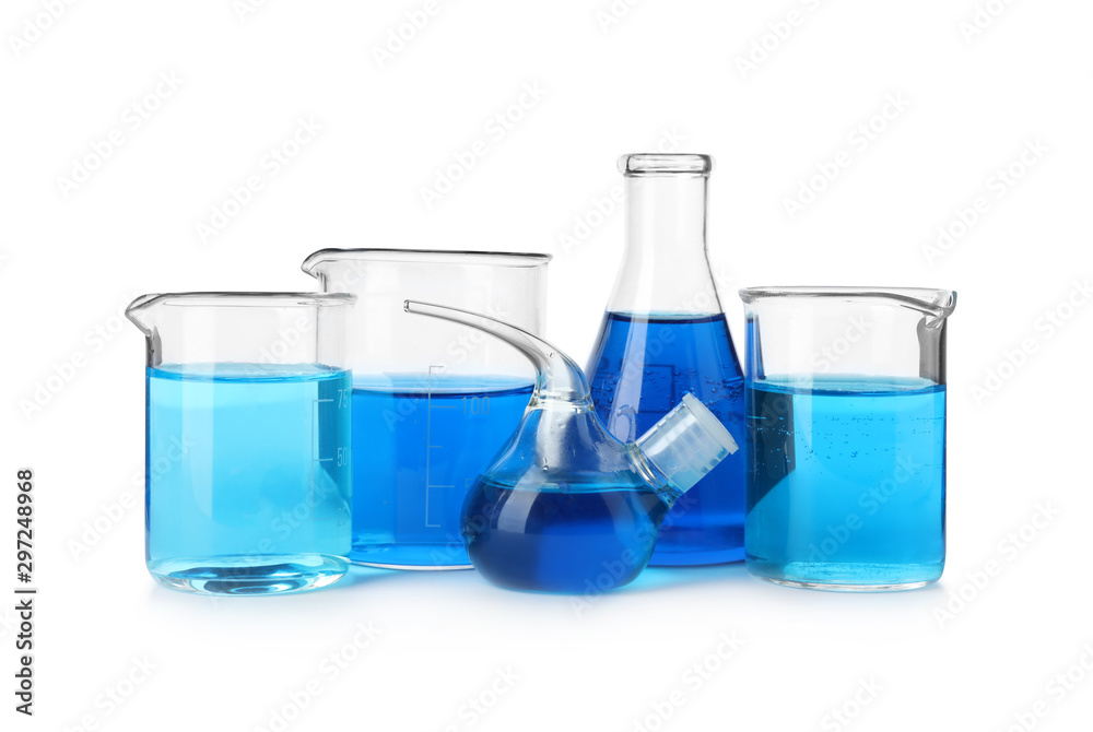 Laboratory glassware with blue liquids isolated on white