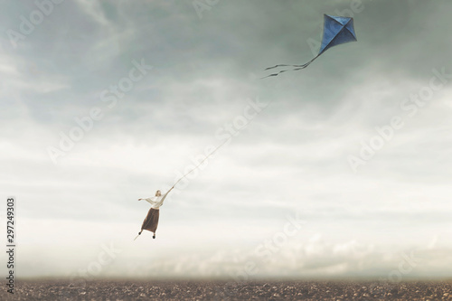Bild auf Leinwand fun and surreal game about a girl flying in the sky with her kite