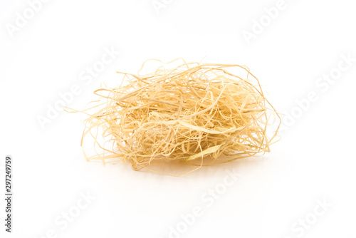 a slender curly sawdust hay closeup on a white background