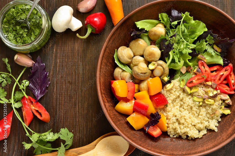 Salad with quinoa, sweet pepper, mushrooms, herbs and pistachios. Healthy nutrition. Vegetarian concept, top view, copy space Salad with quinoa, sweet pepper, mushrooms, herbs and pistachios. Healthy nutrition. Vegetarian concept, top view, copy space