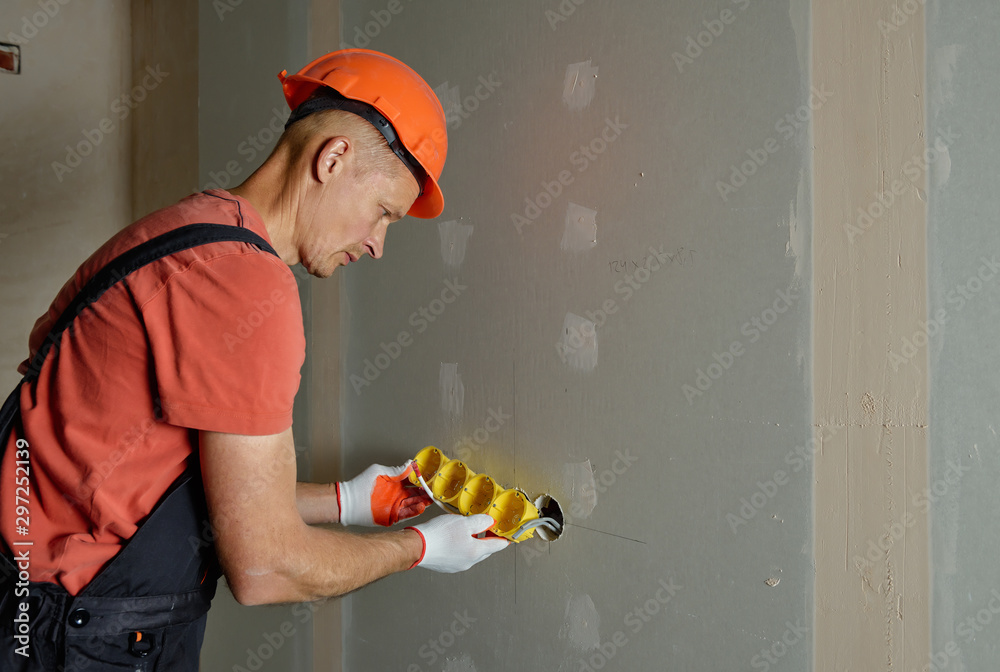 Making holes in the drywall. Making holes in the drywall.