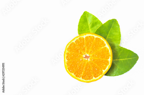 Orange fruit slices and leaf isolated on white background.