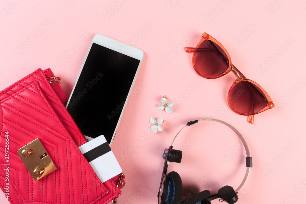 Top view of Women bag and lady stuff with copyspace on pink background - Image Top view of Women bag and lady stuff with copyspace on pink background - Image