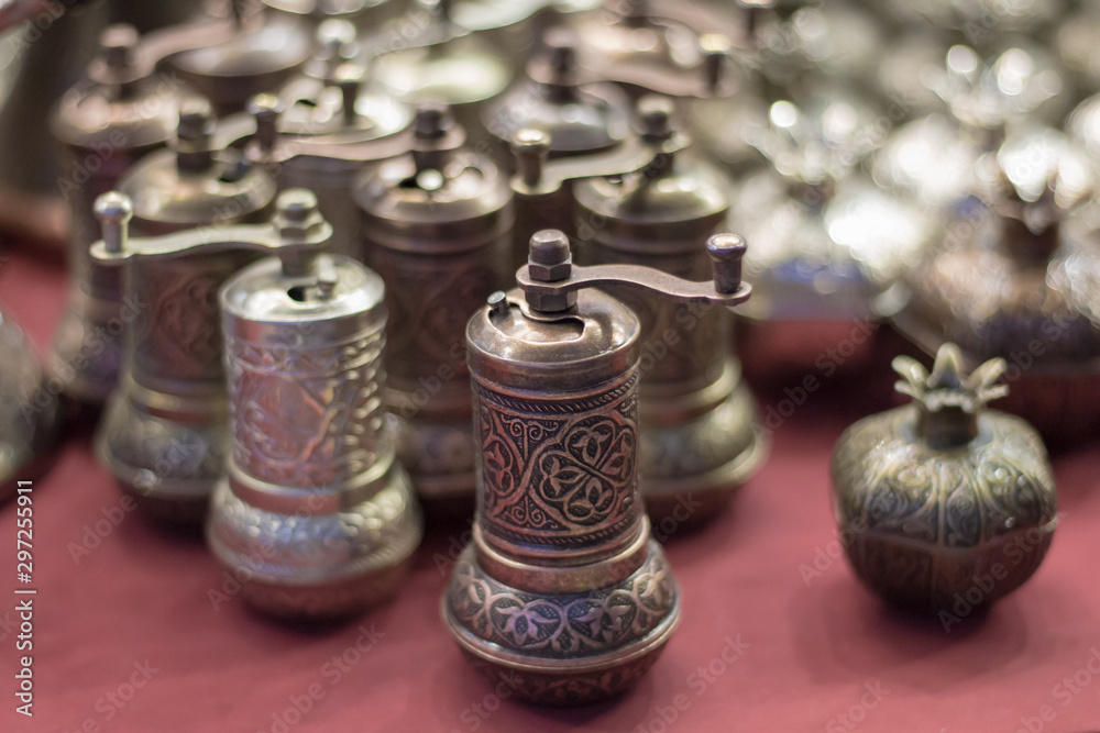 Silver pepper mills on the counter of the Oriental Bazaar. Oriental style Silver pepper mills on the counter of the Oriental Bazaar. Oriental style