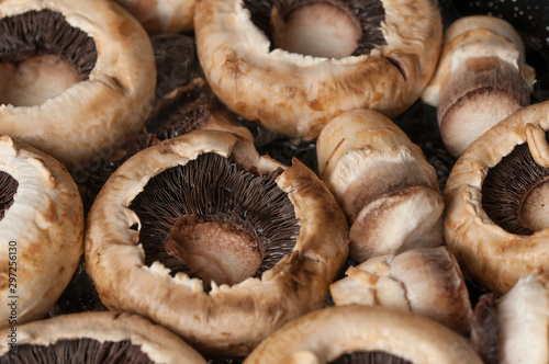 Roasting mushrooms in a black frying pan.Healthy food