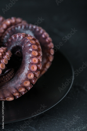 Octopus on a plate on a dark background