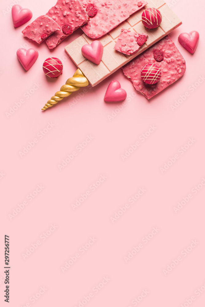 Bar of pink chocolate with gold unicorn horn. Bar of pink chocolate with gold unicorn horn.