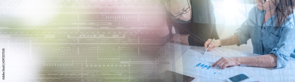 Fototapeta premium Coworkers having a business discussion, light effect; panoramic banner