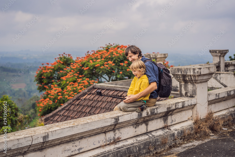 Dad and son tourists in abandoned and mysterious hotel in Bedugul. Indonesia, Bali Island. Bali Travel Concept