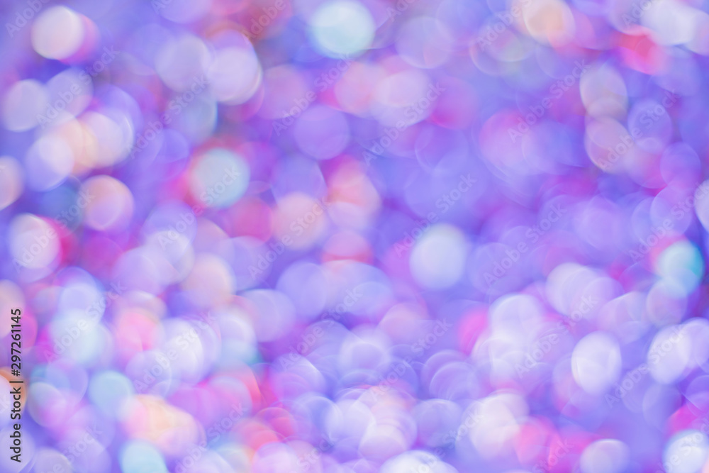 Beautiful bokeh with dynamic neon light. Coffetti shimmer with different colors. Shot from above close-up confetti out of focus. Metallic round confetti glistens in the neon light. Background for