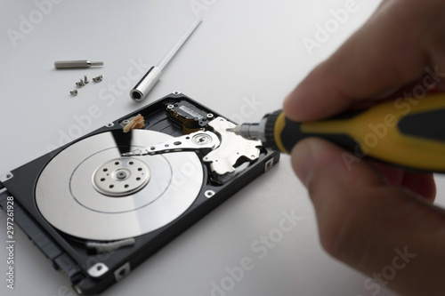 Close up of hard disk's internal mechanism hardware. Soft focus at middle and background.