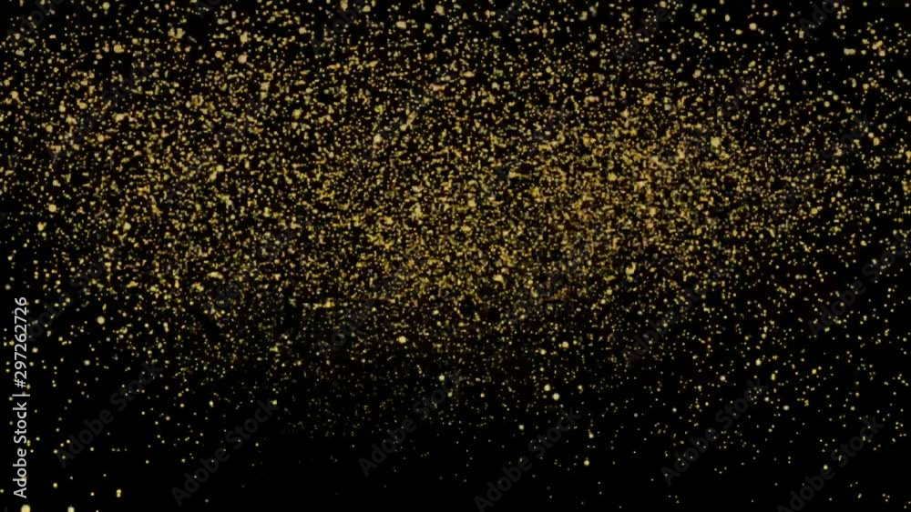 Abstract gold powder dust floating on a black background