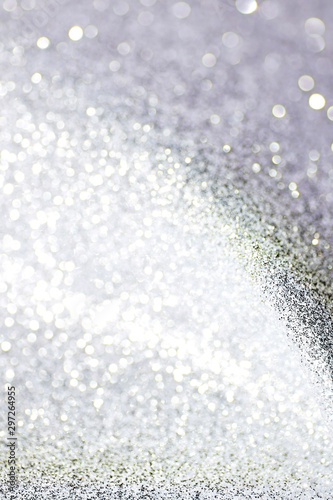 Silver defocused glitter backround with place for text.