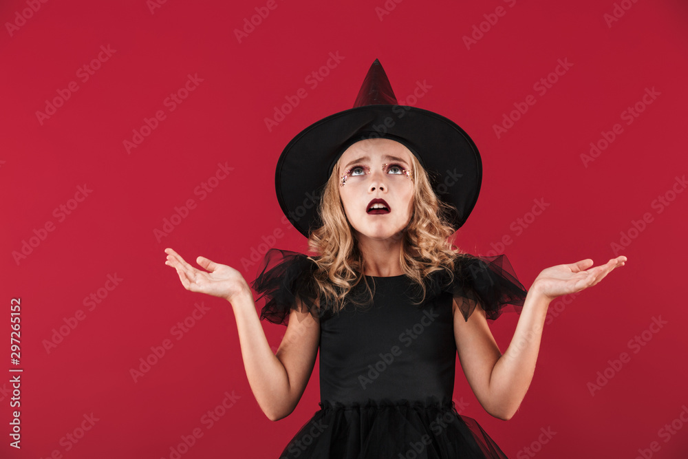 Little girl witch in carnival halloween costume