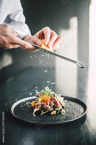 Healthy and delicious beef sandwich on dark table at restaurant, chef making food photo