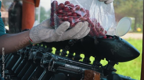 Loading the gun colored balls for paintball games