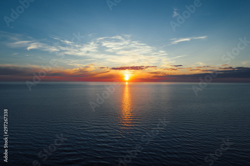 Evening by the sea  beautiful sunset over Baltic seashore  close up view on small waves