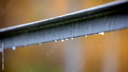 Rain drops on metal structure. Autumn, cool and humid